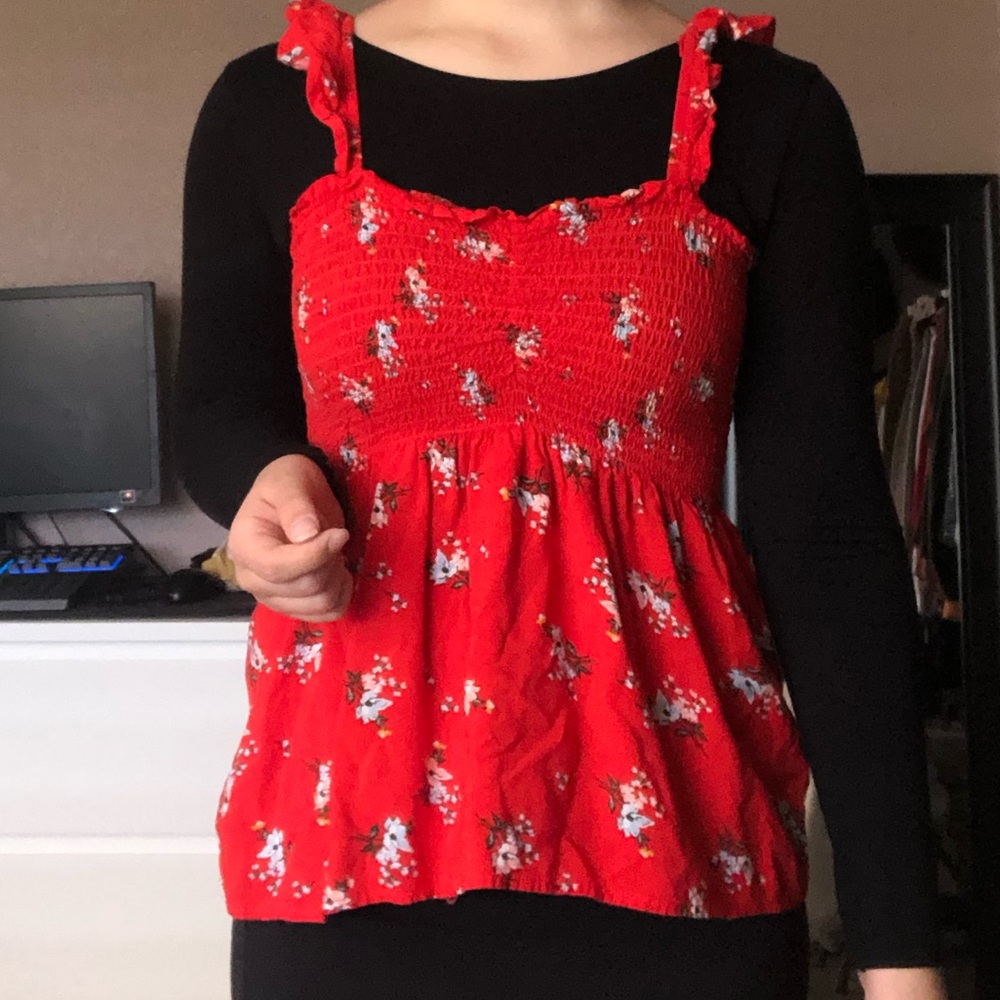 Red floral top.